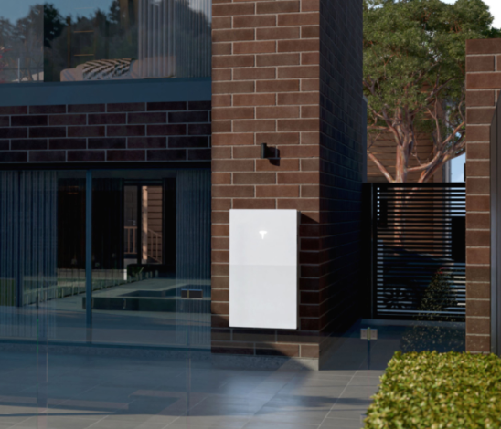 Tesla Powerwall 3 installed on the exterior wall of a modern home