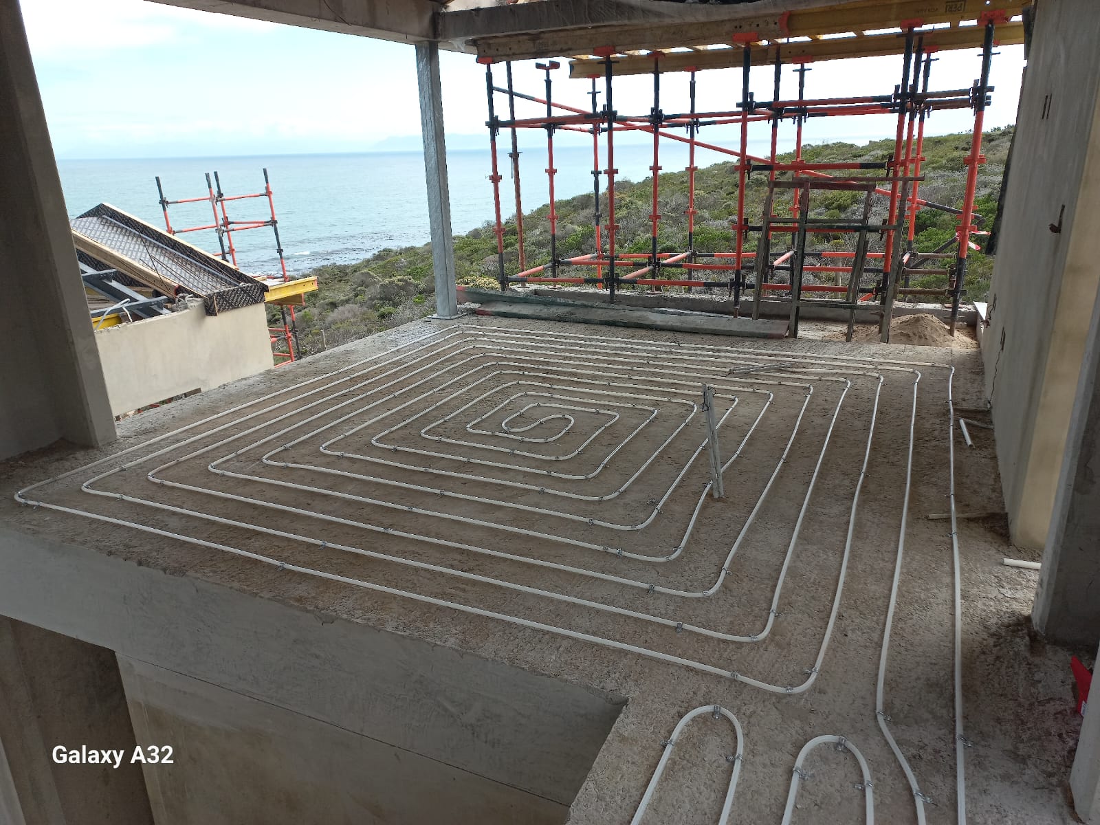 Hydronic underfloor heating installation by Synergy Energy in Romansbaai, Cape Town — 225 m², 32 kW heat pump
